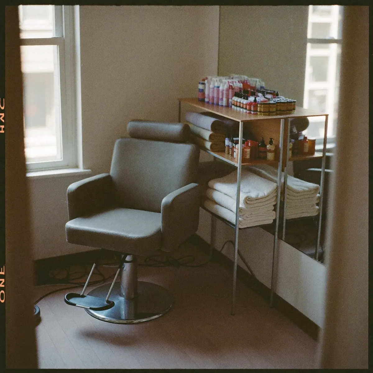 A styling chair and mirror in a quiet corner of the salon