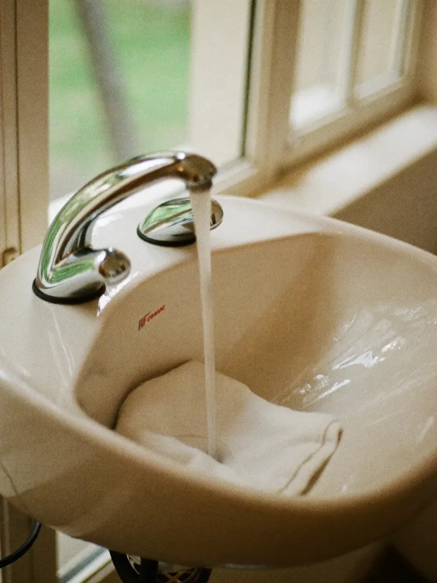 The backwash basin and folded towel at the wash station